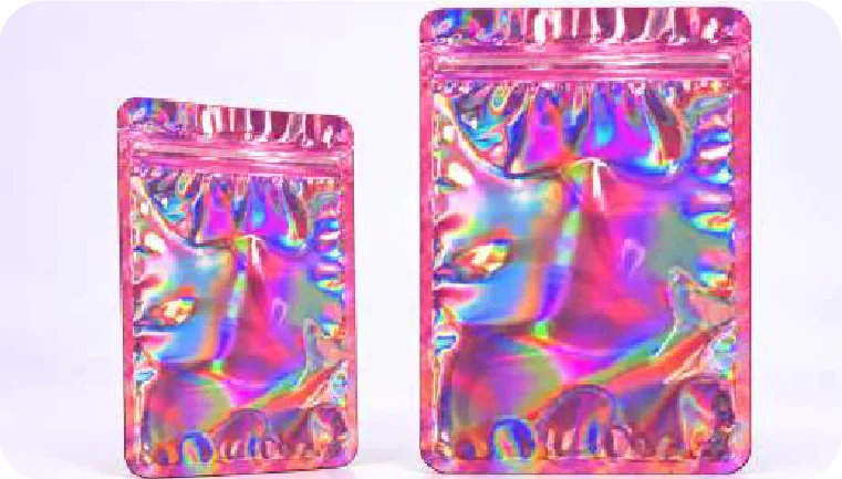 Dos pouches rosa con reflejos de arcoíris, uno más chico y otro más grande, con cierre zipper en el borde superior